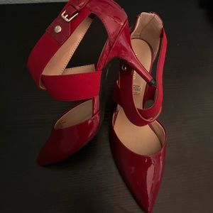 Never worn red heels